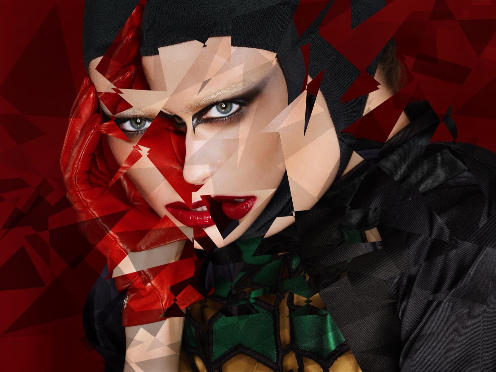 A face in a black hood held by a red leather glove, fractured into shards against deep red. Dimitri Daniloff