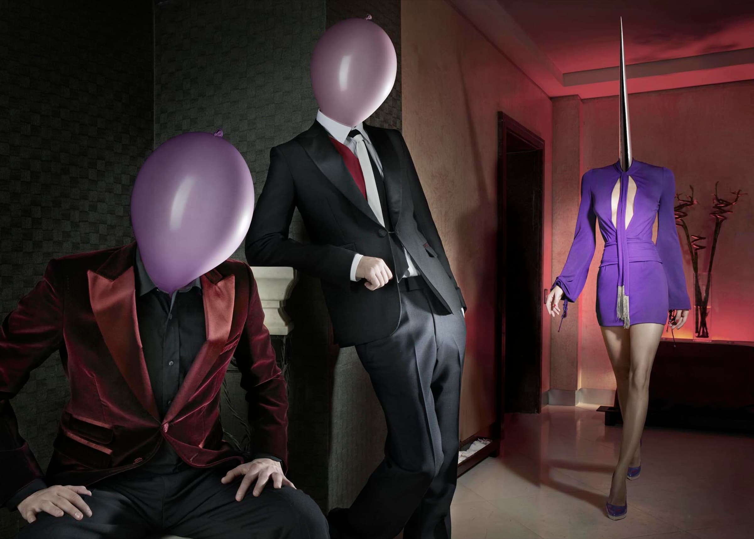 Two balloon-headed men in evening dress and a spike-headed woman in purple, in a red-lit interior. Dimitri Daniloff