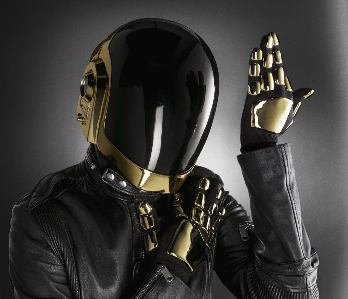 The gold Daft Punk helmet in black leather, one gold-gloved hand raised. Dimitri Daniloff, Daft Punk series